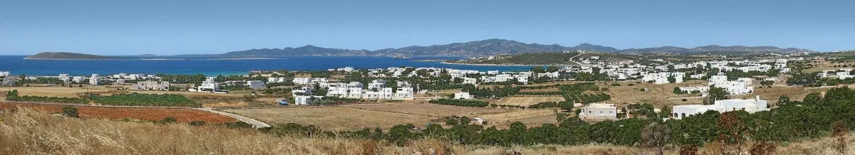 Alyki village waterfront in Paros with tavernas by the water
